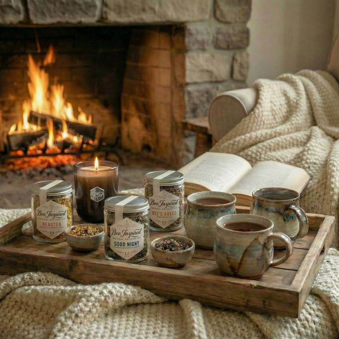 Relaxation Tea Set on Wooden tray with 3 tea jars, a candle, and 3 mugs in front of a fireplace.
