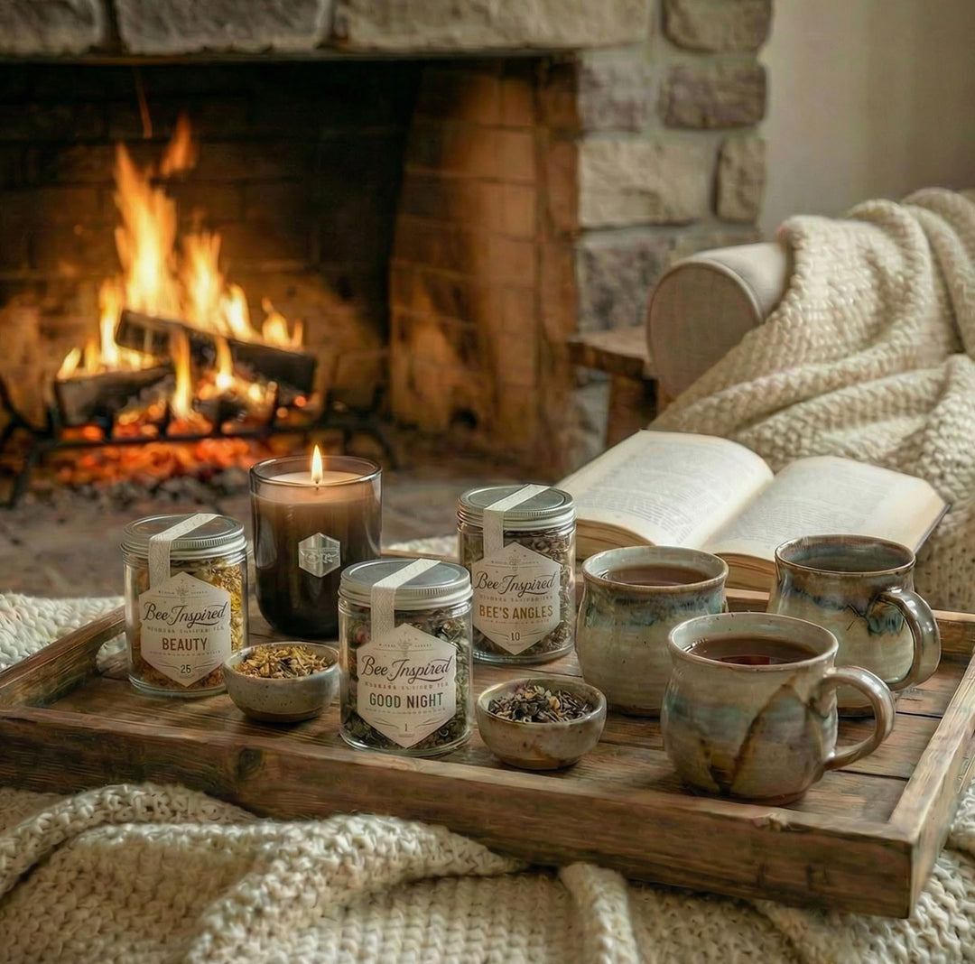 Relaxation Tea Set on Wooden tray with 3 tea jars, a candle, and 3 mugs in front of a fireplace.