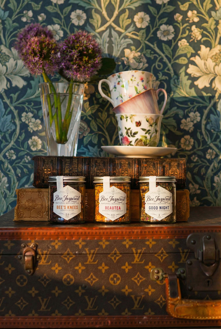 relaxation tea set on a decorative surface with floral wallpaper in the background