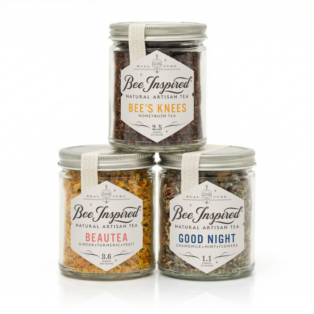 Three jars of Bee Inspired natural artisan tea on a white background