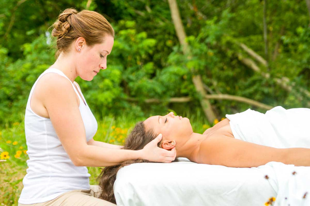 a woman gets a massage in field