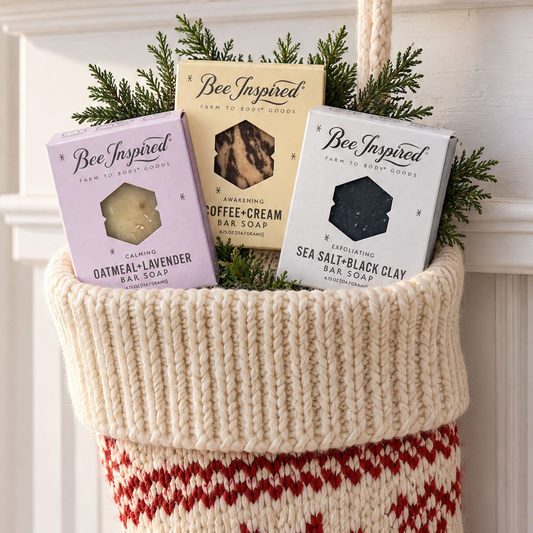 all three soaps n a holiday stocking surorounded by holiday greenery