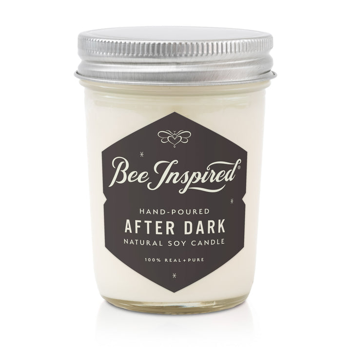 Candle jar labeled 'Bee Inspired After Dark' on a white background