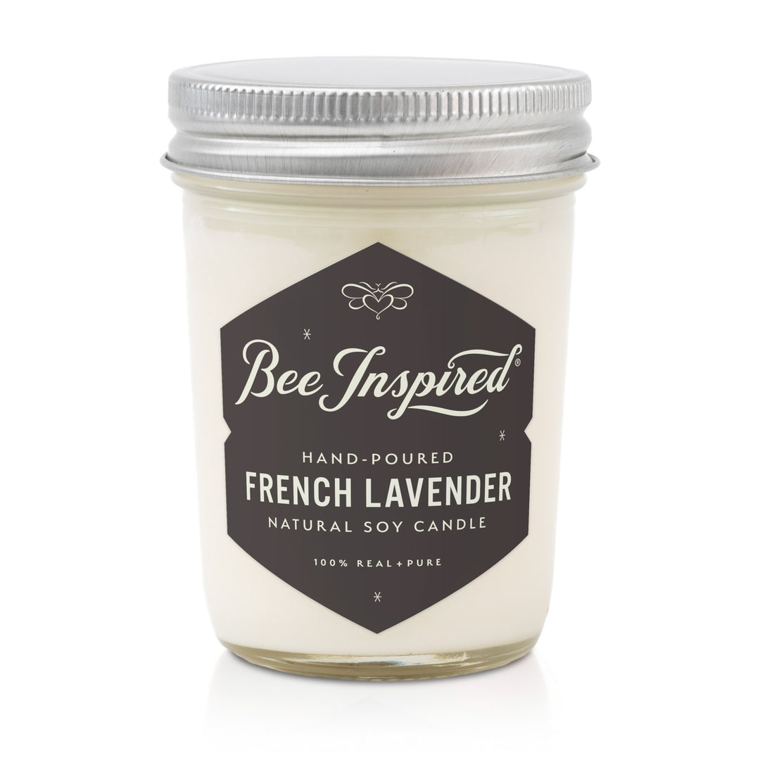 Bee Inspired French Lavender candle in a glass jar with a metal lid on a white background