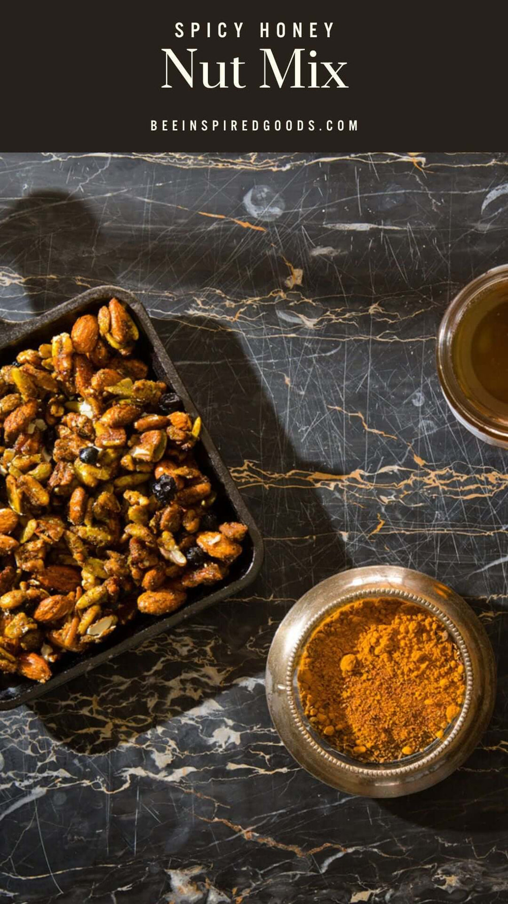 "Spicy Honey Nut Mix beeinspiredgoods.com" a container of nuts and a jar of orange spices