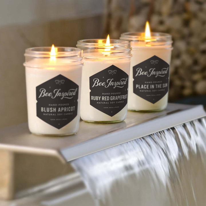 Summer Candle Set burning on the faucet of a bath tub