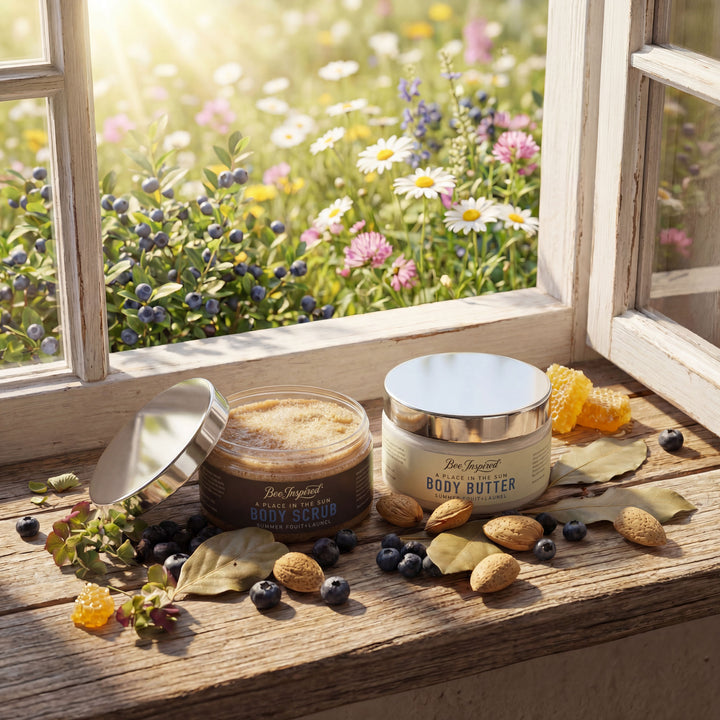 Two jars of body butter on a windowsill with a view of flowers outside.