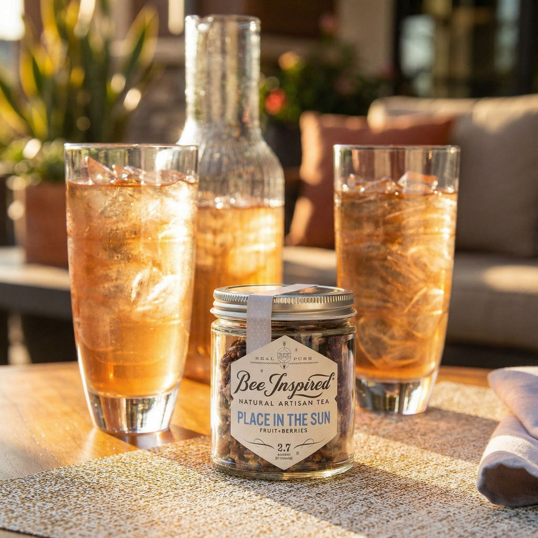 Place in the Sun loose leaf tea with brewed iced tea in glasses