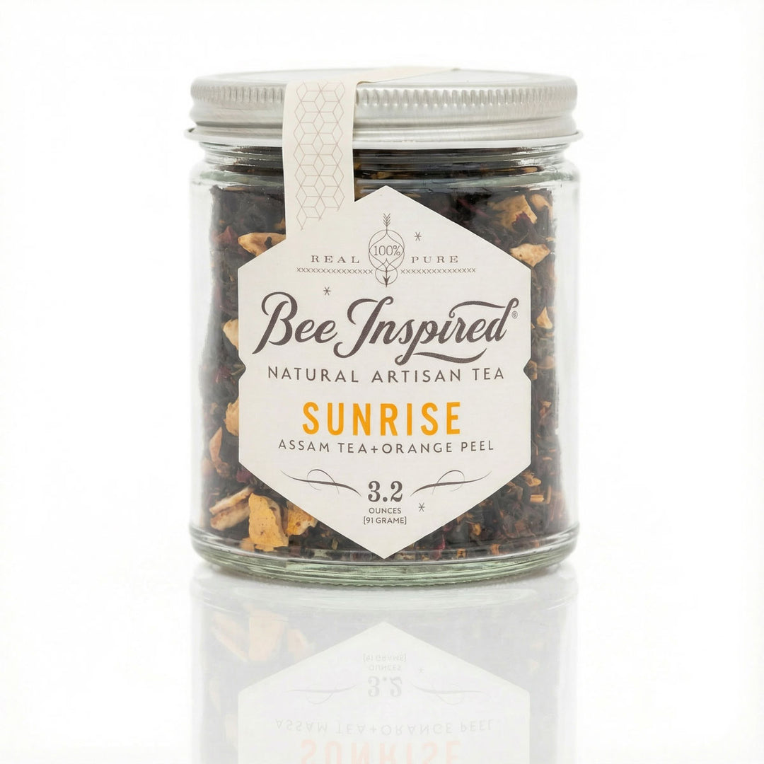 Jar of 'Bee Inspired' natural artisan tea labeled 'Sunrise' on a white background