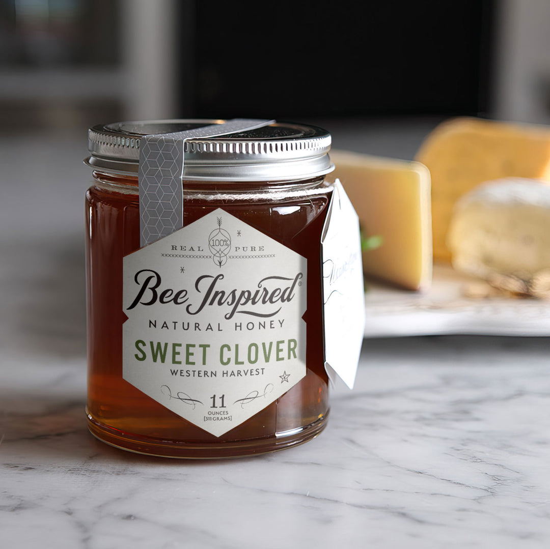 Sweet Clover honey in front of cheese board 