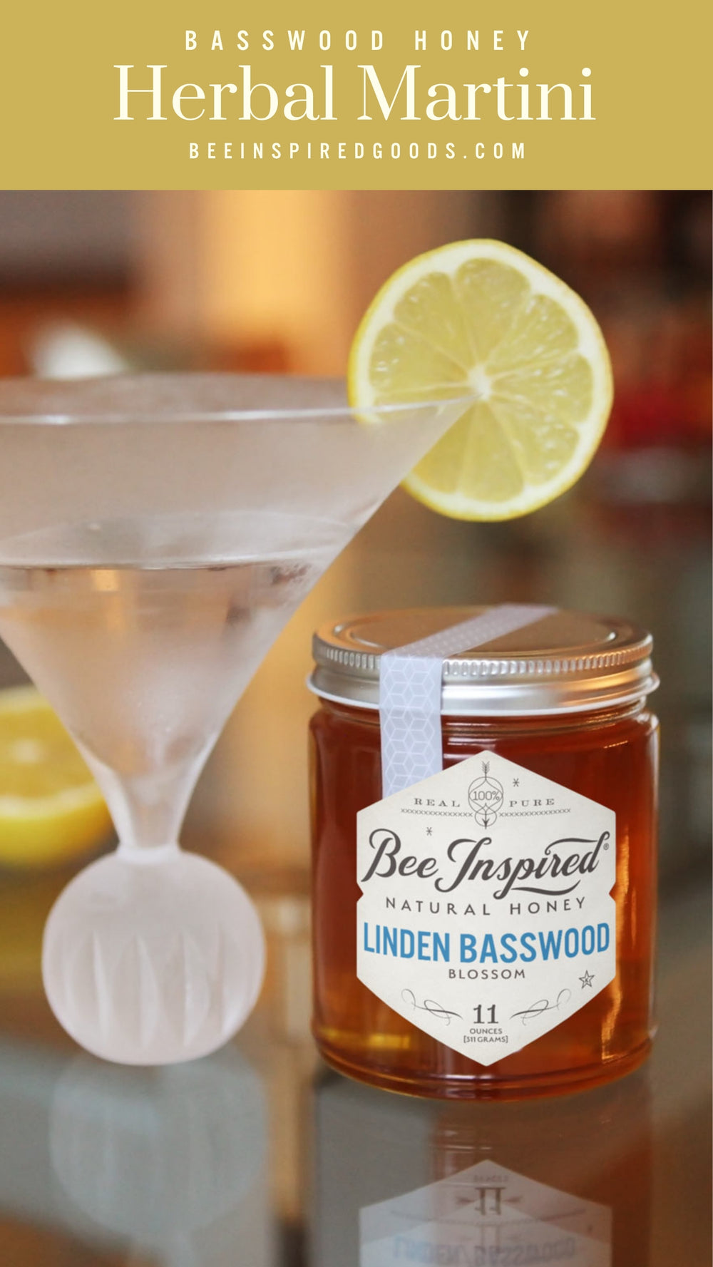 a martini garnished with lemon next to a jar of linden basswood honey