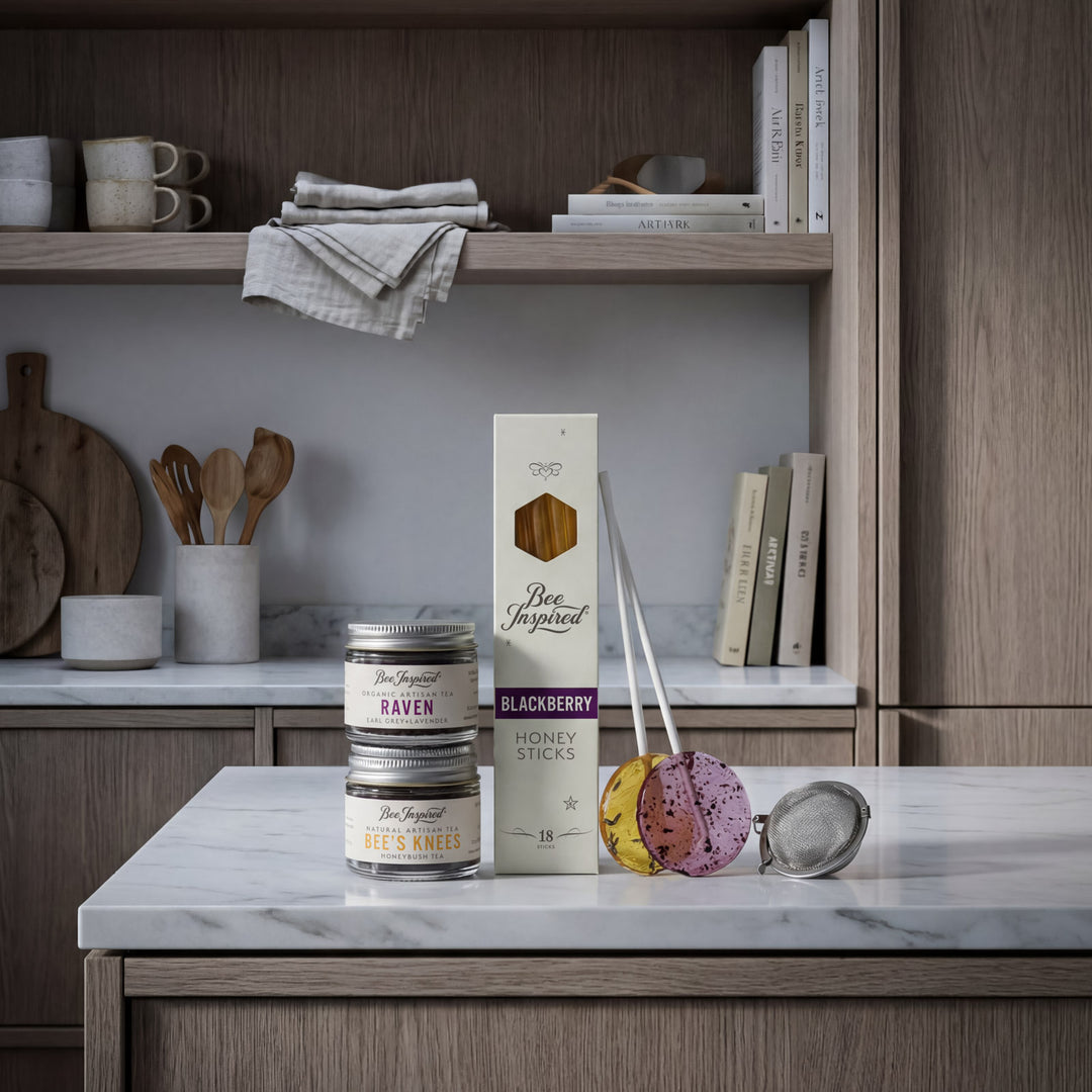 Kitchen counter with Bee Inspired honey products and kitchen utensils.