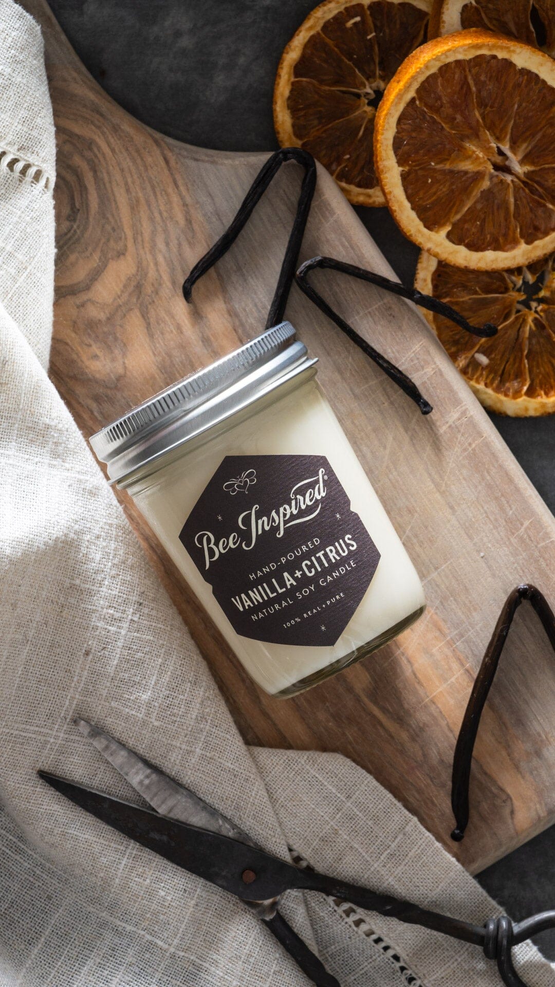 Vanilla and Citrus Soy Candle with ingredients tall pin